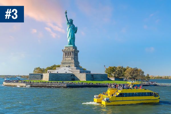 Boat in front of the Statue of Liberty