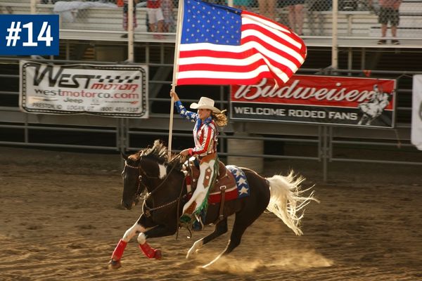 Woman on horseback with USA flag