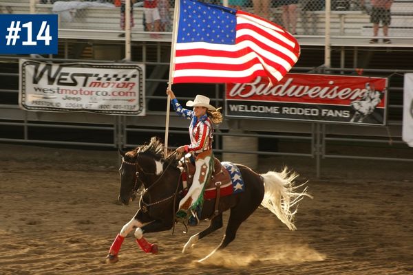 Woman on horseback with USA flag