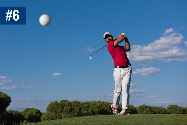 Golf player playing a tee shot